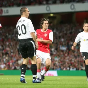Tomas Rosicky shoots past Sparta Prague goalkeeper Tomas Postulka to score the 1st Arsenal goal Tomas Rosicky shoots past Sparta Prague goalkeeper Tomas Postulka to score the 1st Arsenal goal