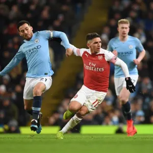 Torreira Stands Firm: A Defiant Tackle Against Manchester City's Silva in the Intense 2018-19 Premier League Clash Torreira Stands Firm: A Defiant Tackle Against Manchester City's Silva in the Intense 2018-19 Premier League Clash