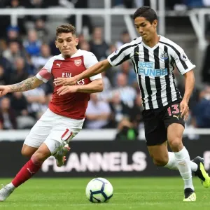 Torreira vs. Muto: A Premier League Battle at St. James Park - Arsenal's Torreira Clashes with Newcastle's Muto