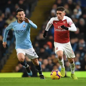 Torreira vs Silva: Intense Tackle in the Premier League Showdown between Manchester City and Arsenal, 2018-19 Torreira vs Silva: Intense Tackle in the Premier League Showdown between Manchester City and Arsenal, 2018-19