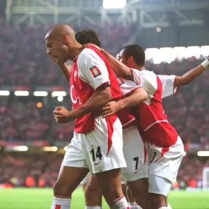 Triumph at The Millennium: Pires, Henry, and Cole Celebrate Arsenal's FA Cup Win over Southampton (1:0) Triumph at The Millennium: Pires, Henry, and Cole Celebrate Arsenal's FA Cup Win over Southampton (1:0)