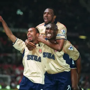 Triumphant Threesome: Arsenal's Vieira, Cole, and Campbell Celebrate Championship Victory over Manchester United Triumphant Threesome: Arsenal's Vieira, Cole, and Campbell Celebrate Championship Victory over Manchester United