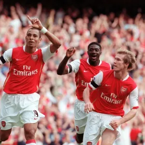 Print of Gilberto celebrating Arsenal's equalizer with Hleb and Toure Print of Gilberto celebrating Arsenal's equalizer with Hleb and Toure