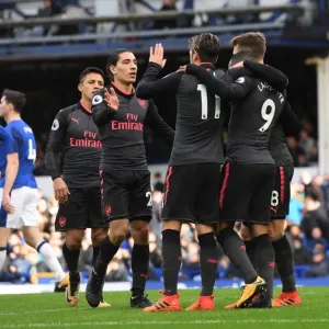 Triumphant Threesome: Lacazette, Ozil, and Bellerin Celebrate Arsenal's Goals Against Everton Triumphant Threesome: Lacazette, Ozil, and Bellerin Celebrate Arsenal's Goals Against Everton