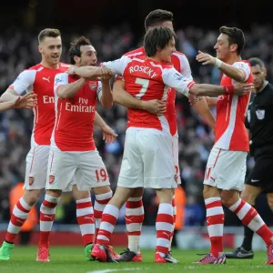 Triumphant Threesome: Rosicky, Ozil, and Cazorla Celebrate Arsenal's 2-0 Over Everton Triumphant Threesome: Rosicky, Ozil, and Cazorla Celebrate Arsenal's 2-0 Over Everton