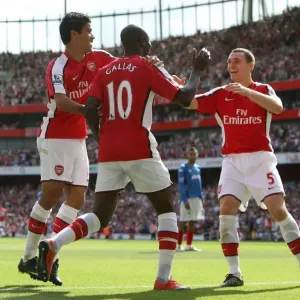 Triumphant Threesome: William Gallas, Eduardo, and Thomas Vermaelen Celebrate Arsenal's 4-1 Victory Over Portsmouth Triumphant Threesome: William Gallas, Eduardo, and Thomas Vermaelen Celebrate Arsenal's 4-1 Victory Over Portsmouth