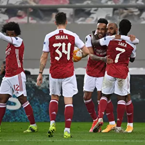 Triumphant Trio: Aubameyang, Lacazette, and Saka's Goal Celebration in Arsenal's Europa League Victory over SL Benfica