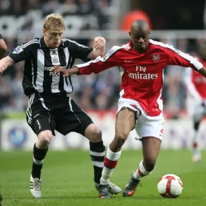 Triumphant Trios: Abou Diaby and Damien Duff Clash in Arsenal's 3-1 Victory over Newcastle United, 2009