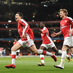 Triumphant Triple: Nasri, Bendtner, and Eboue Celebrate Arsenal's 5-0 Victory over FC Porto