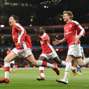 Triumphant Triple: Nasri, Bendtner, and Eboue Celebrate Arsenal's 5-0 Victory over FC Porto Triumphant Triple: Nasri, Bendtner, and Eboue Celebrate Arsenal's 5-0 Victory over FC Porto