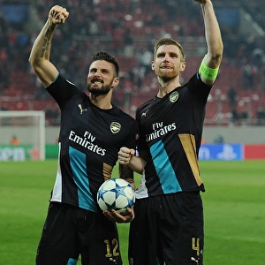 Unforgettable Celebration: Giroud and Mertesacker's Victory Moment at Olympiacos vs. Arsenal, UEFA Champions League (December 2015)