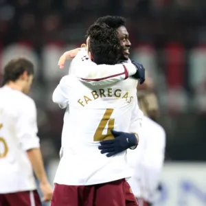 Unforgettable Moment: Fabregas and Adebayor's Euphoric Goal Celebration in Arsenal's 2-0 Victory over AC Milan, UEFA Champions League, 2008