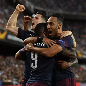 United in Victory: Aubameyang, Lacazette, and Xhaka's Goal Celebration - Arsenal's Europa League Semi-Final Triumph over Valencia
