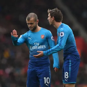 Unwavering Focus: Monreal and Wilshere's Intense Concentration during Arsenal's Premier League Clash at Southampton (2017-18)