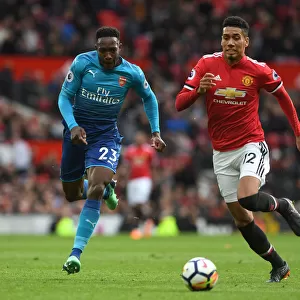 Welbeck vs Smalling: A Premier League Battle - Arsenal's Danny Welbeck Clashes with Manchester United's Chris Smalling
