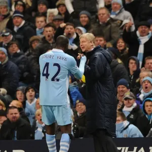 Wenger and Toure: A Light-Hearted Moment Amidst the Manchester Rivalry (2011-12)