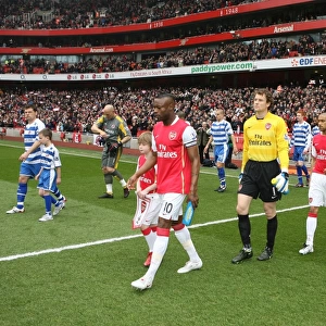 William Gallas (Arsenal) and Graeme Murty (Reading) lead out the teams before the match