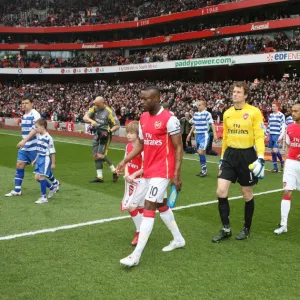 William Gallas (Arsenal) and Graeme Murty (Reading) lead out the teams before the match