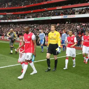 William Gallas (Arsenal) and Graeme Murty (Reading) lead out the teams before the match