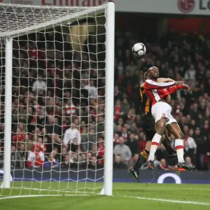 William Gallas heads over Hull City defender Andy Dawson William Gallas heads over Hull City defender Andy Dawson