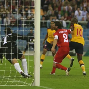 William Gallas shoots past FC Twente goalkeeper Sander William Gallas shoots past FC Twente goalkeeper Sander