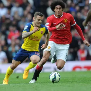 Wilshere Surges Past Fellaini: Manchester United vs. Arsenal, Premier League 2014-15 - Intense Rivalry on the Field Wilshere Surges Past Fellaini: Manchester United vs. Arsenal, Premier League 2014-15 - Intense Rivalry on the Field