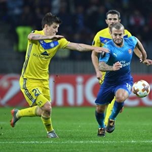 Wilshere vs. Dragun: A Europa League Battle - Arsenal's Jack Wilshere Takes on FC BATE Borisov's Stanislav Dragun