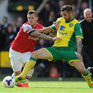 Wilshere vs. Johnson: Intense Battle in Norwich City vs. Arsenal (Premier League 2013-14)