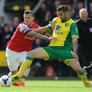 Wilshere vs. Johnson: Intense Battle in Norwich City vs. Arsenal (Premier League 2013-14)