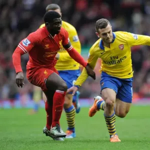 Wilshere's Determined Stride: Outpacing Rival Kolo Toure in the Liverpool vs. Arsenal Premier League Clash Wilshere's Determined Stride: Outpacing Rival Kolo Toure in the Liverpool vs. Arsenal Premier League Clash