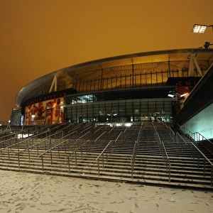 Winter's Embrace at Emirates: Arsenal Football Club in a Snow-Covered Stadium
