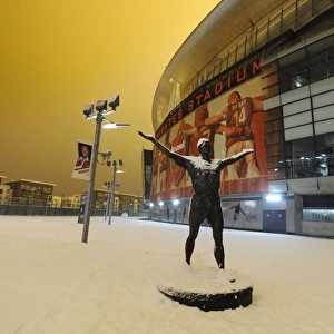 Winter's Grip: Arsenal's Emirates Stadium Blanketed in Snow, Premier League 2012, London