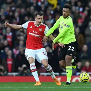 Xhaka Under Fire: Intense Pressure from Mousset in Arsenal vs. Sheffield United Clash