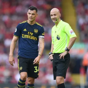 Xhaka and Referee Taylor in Heated Discussion: Liverpool vs. Arsenal, Premier League 2019-20 Xhaka and Referee Taylor in Heated Discussion: Liverpool vs. Arsenal, Premier League 2019-20