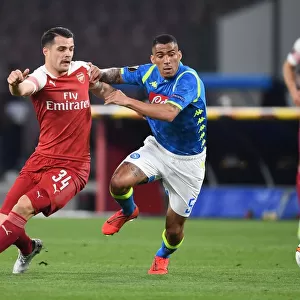 Xhaka vs Allan: A Fierce Battle in the Europa League Showdown between Napoli and Arsenal, 2019