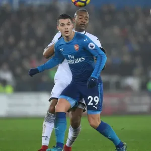 Xhaka vs Ayew: Intense Battle in Swansea City vs Arsenal Premier League Clash Xhaka vs Ayew: Intense Battle in Swansea City vs Arsenal Premier League Clash