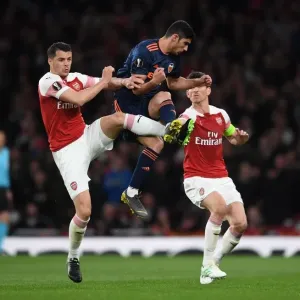 Xhaka vs. Guedes: A Midfield Showdown in the Arsenal vs. Valencia UEFA Europa League Semi-Final