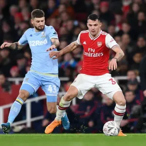 Xhaka vs Klich: A Midfield Battle in Arsenal's FA Cup Clash against Leeds United Xhaka vs Klich: A Midfield Battle in Arsenal's FA Cup Clash against Leeds United