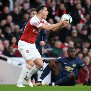Xhaka vs Pogba: Intense Clash Between Arsenal's Granit Xhaka and Manchester United's Paul Pogba during the Premier League Match