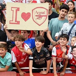 Young Arsenal Fans Celebrate Emirates Cup Victory over Sevilla