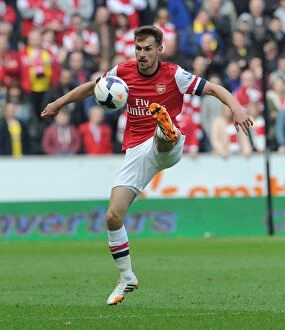 Images Dated 20th April 2014: Aaron Ramsey in Action: Arsenal vs Hull City, Premier League 2013-2014