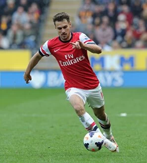 Hull City v Arsenal 2013/14 Collection: Aaron Ramsey in Action: Arsenal's Midfield Maestro Shines Against Hull City (2013-2014)