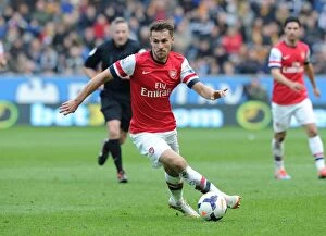 Hull City v Arsenal 2013/14 Collection: Aaron Ramsey in Action: Arsenal's Midfield Maestro Shines Against Hull City (2013-2014)