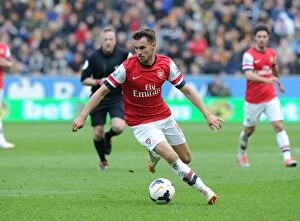 Hull City Collection: Aaron Ramsey in Action: Hull City vs Arsenal, Premier League 2013-2014