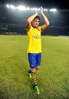 Indonesia Dream Team v Arsenal 2013-14 Collection: Aaron Ramsey Appreciates Fans after Arsenal's Win against Indonesia All-Stars