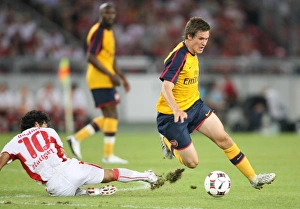 Stuttgart V Arsenal 2008-09 Prints: Aaron Ramsey (Arsenal) Basturk (Stuttgart)