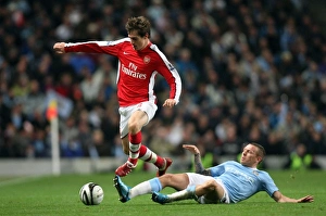 Manchester City v Arsenal - Carling Cup 2009-10 Collection: Aaron Ramsey (Arsenal) Craig Bellamy (Man City). Manchester City 3: 0 Arsenal