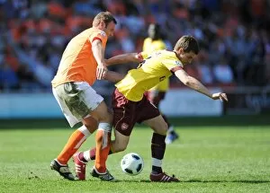 Images Dated 10th April 2011: Aaron Ramsey (Arsenal) Ian Evatt (Blackpool). Blackpool 1: 3 Arsenal, Barclays Premier League