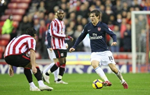 Images Dated 21st November 2009: Aaron Ramsey (Arsenal) Lorik Cana (Sunderland). Sunderland 1: 0 Arsenal