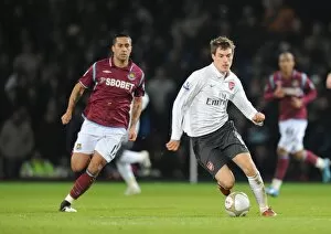 West Ham United v Arsenal FA Cup 2009-10 Collection: Aaron Ramsey (Arsenal) Luis Jimenez (West Ham). West Ham United 1: 2 Arsenal